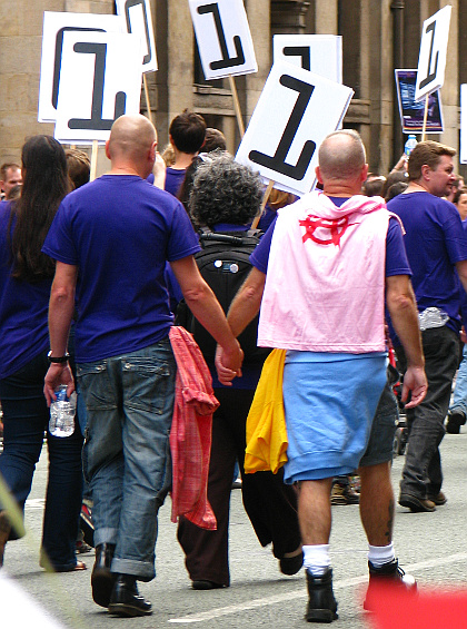 Photo of two men holding hands in University of Manchester's 2012 Pride parade entry.